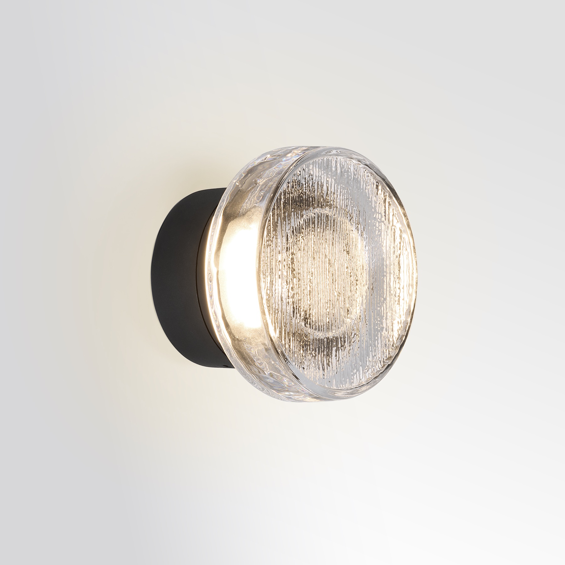 Textured glass Marset Roc diffuser photographed while illuminated