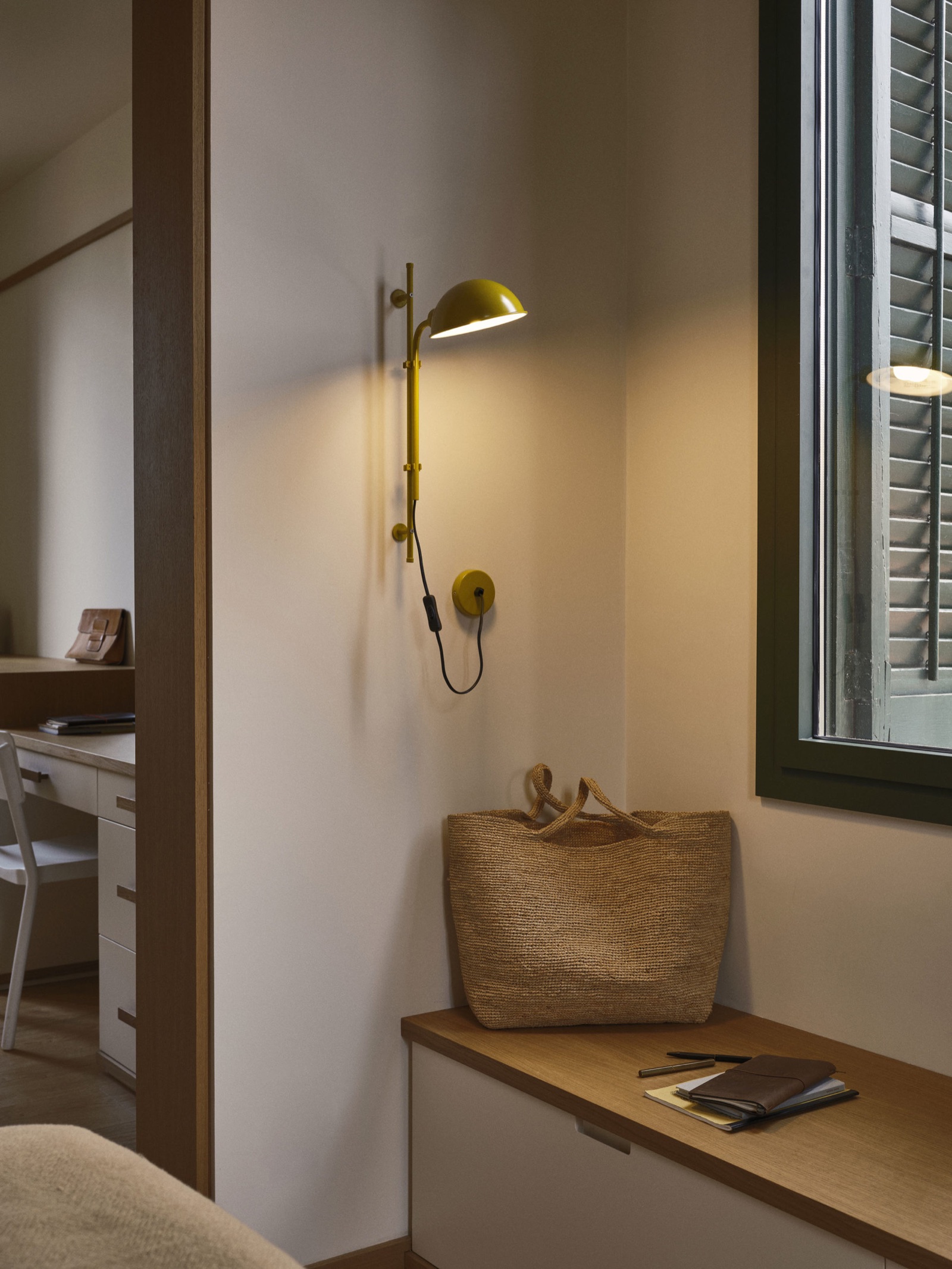 Marset Funiculi wall light photographed in a warm residential interior